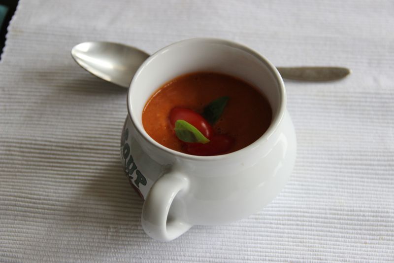 Creamy tomato soup served with crusty bread